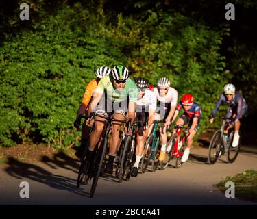 Cyclists caught in action whilst competing in a Criterium Race at Crystal Palace Park. Stock Photo