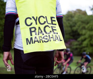 A view of a cycle race Marshall as he watches cyclists compete in a Criterium Race at Crystal Palace Park. Stock Photo