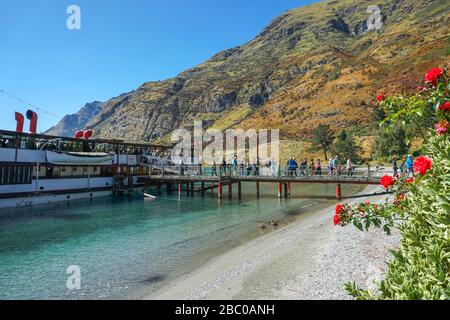 Embarking TSS Earnslaw at Walter Peak Station Lake Wakatipu New Zealand Stock Photo