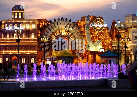 Night time shot of the Americas section inside Global Village, Dubai, UAE. Global Village combines cultures of 90 countries across the world. Stock Photo