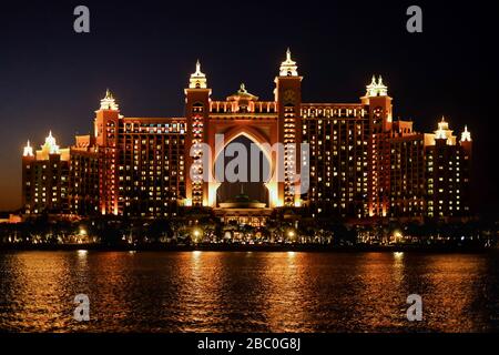 Night time shot of The Palm Atlantis Resort, a luxury hotel resort at Palm Jumeirah, Dubai, United Arab Emirates. Stock Photo