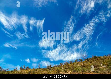 Blue sky and spectacular cirrus clouds over the Pyrenees at Ornolac, Ussat les Bains, Ariege, French Pyrenees, France Stock Photo