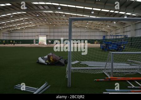 Discarded sports equipment as workers lay flooring during the construction of a field hospital, which will hold up to 340 beds for coronavirus patients, at Llandarcy Academy of Sport, Neath, as the health services in the Swansea Bay area prepare their response to the coronavirus outbreak. Stock Photo