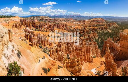 Scenic panoramic view of famous Bryce Canyon National Park on a beautiful sunny day with blue sky and dramatic clouds seen from famous Sunset Point Stock Photo