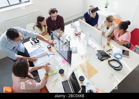 Open Plan Working Designers working in an open plan office space Stock Photo - Alamy