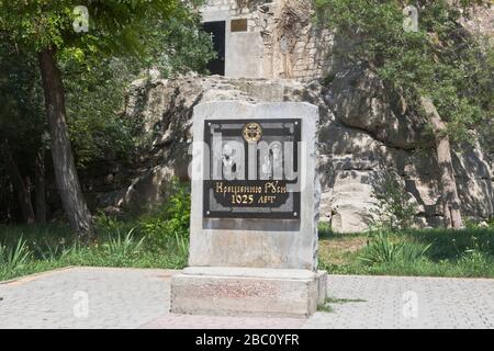 Inkerman, Sevastopol, Crimea, Russia - July 27, 2019: Memorial sign to the Baptism of Russia 1025 years old at the Church of the Holy Great Martyr Dem Stock Photo