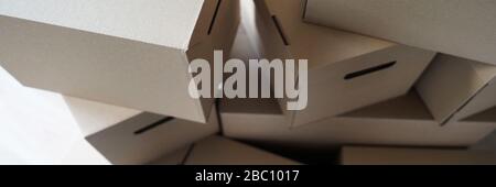 Pile of carton boxes standing in the middle of empty room in new house Stock Photo