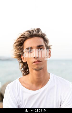 Portrait of handsome young man outdoors Stock Photo
