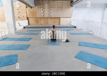 Man doing stretching exercises before climbing Stock Photo