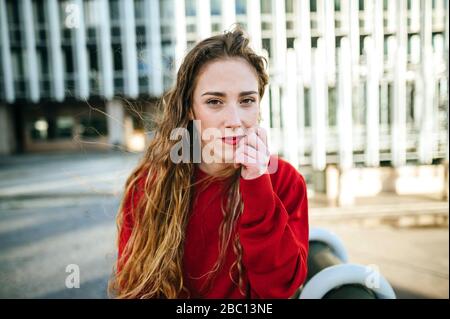 Portrait of beautiful young woman in the city Stock Photo