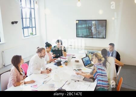 Architects working in conference room meeting Stock Photo