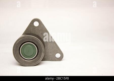 Car belt tensioner isolated on the white background. Stock Photo