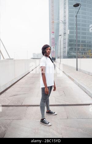 Sportive young woman posing in the city Stock Photo