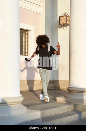 Young man listening to music and dancing Stock Photo
