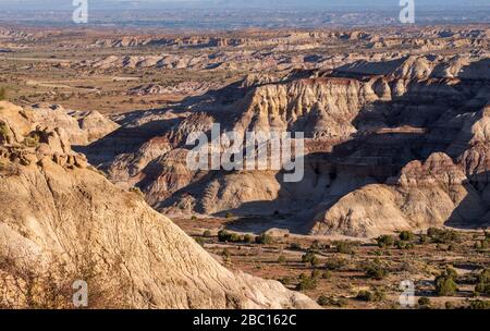 High angle landscape of barren striped hills or badlands at Angel Peak Wilderness in New Mexico Stock Photo