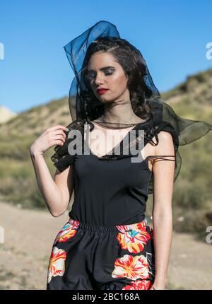 Young woman wearing black and a veil, portrait Stock Photo - Alamy