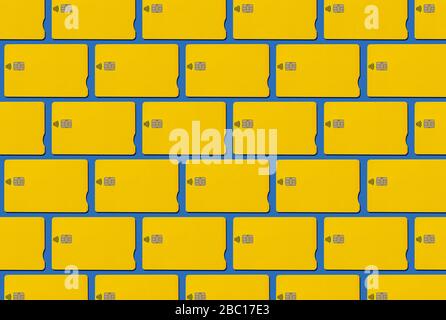 Yellow contactless credit cards pattern on blue background Stock Photo