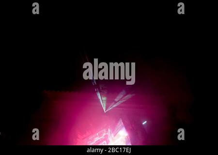 Soft focus, smoke at a night disco, vibrant stage, neon lights and beams of light at the Club Phaselis Rose Hotel in Kemer, director and animators of Stock Photo