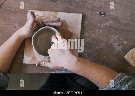 Close-up of potter working on workpiece Stock Photo