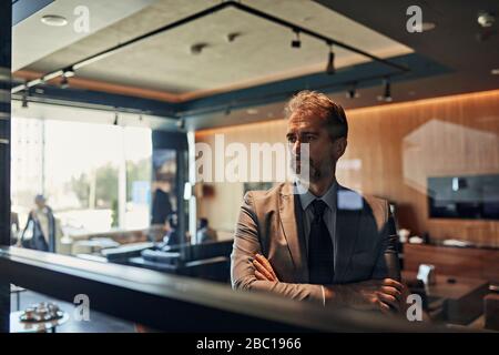 Portrait of a mature businessman in hotel lobby Stock Photo