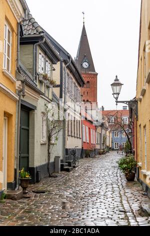 Pretty, colourful cottages in Aalborg, Denmark, on a wet, winters day. Stock Photo