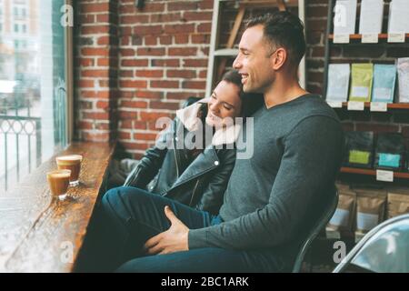 Happy couple having coffee in a cafe Stock Photo