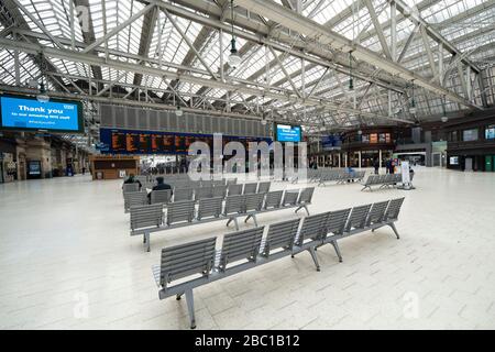 Glasgow, Scotland, UK. 1 April, 2020. Effects of Coronavirus lockdown on streets of Glasgow, Scotland. Concourse of Central Station is very quiet. Stock Photo