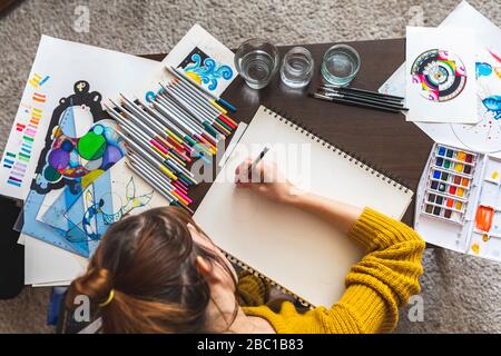Crop view of woman drawing at home Stock Photo