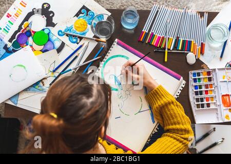 Woman painting with watercolours, top view Stock Photo