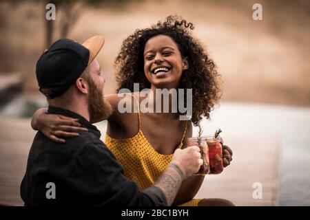 Happy couple drinking fresh ice tea Stock Photo