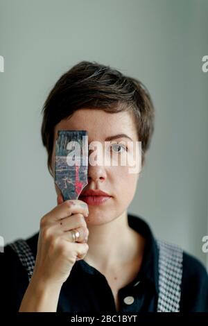 Portrait of a female painter holding a paintbrush Stock Photo