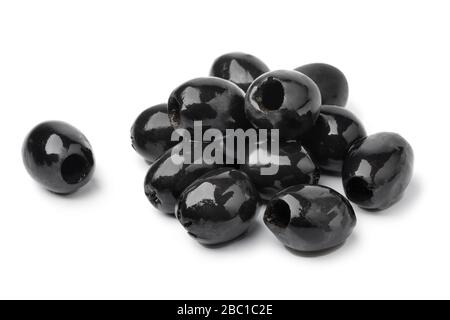 Pitted black olives as an ingredient for cooking isolated on white background Stock Photo