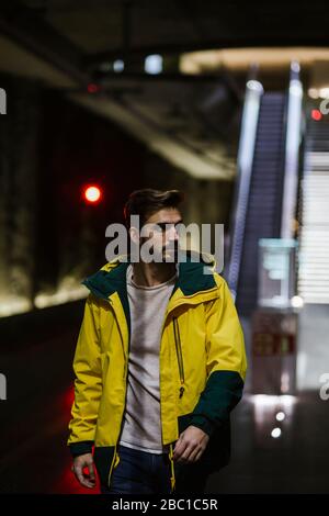 Man walking in subway station Stock Photo