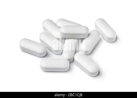 Heap of white medicine tablets isolated on white background Stock Photo