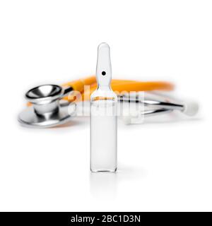 Medical drug ampule and stethoscope isolated on white background Stock Photo