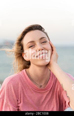Portrait of happy young woman outdoors Stock Photo