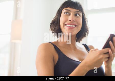 Happy beautiful woman using smart phone Stock Photo
