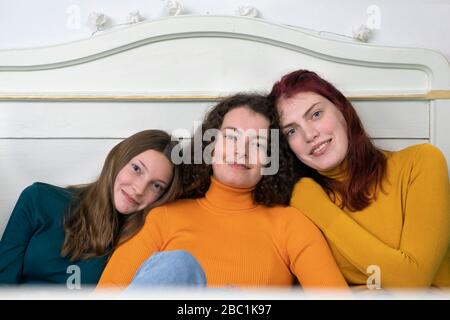 Portrait of three happy sisters Stock Photo