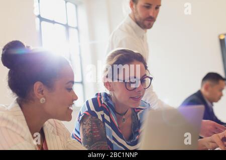 Businesswomen talking in conference room meeting Stock Photo