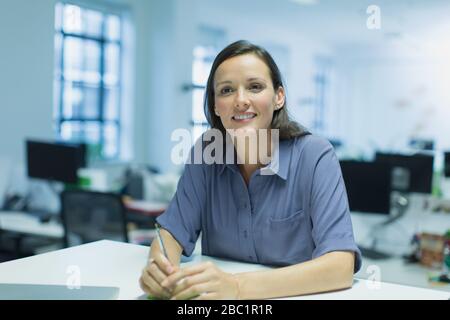Portrait smiling, confident businesswoman in office Stock Photo