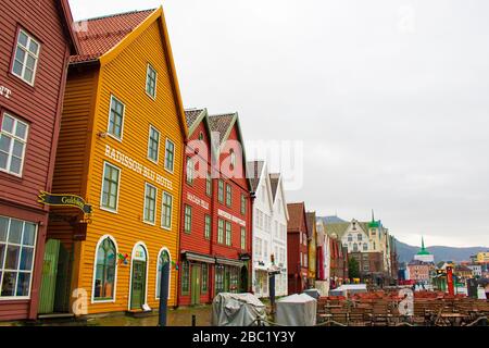 View of Bryggen on summer rainy day ,Bergen,Norway.A medieval wharf in the historic harbour district known for its colourful, wooden-clad boat houses. Stock Photo