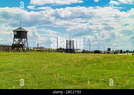 Fence and watchtowers surrounding the World War 2 Nazi concentration camp at Majdanek, now open as a memorial site. Lublin, Poland. June 2017. Stock Photo