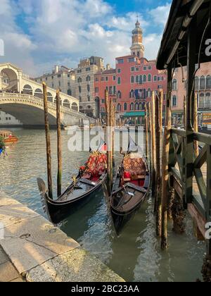 Gondolas moored up in the historic town of Venice Stock Photo