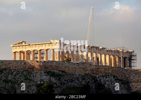 The Parthenon on the Acropolis in Athens, Greece. A crane rises above the landmark during restorations. Stock Photo