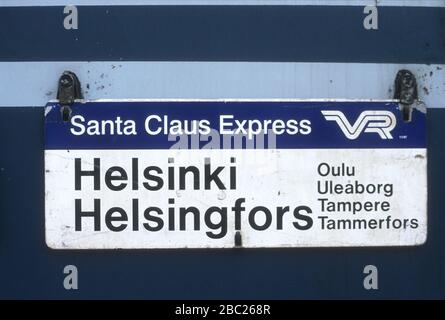 Sign on the Santa Claus Express to Helsinki in the railway station at Oulu,  Finland. Destinations are listed in both the Finnish and Swedish forms  Stock Photo - Alamy