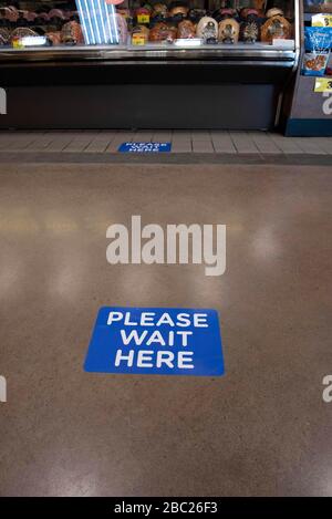 Roswell, GA, USA. 2nd Apr, 2020. A sign newly affixed to Kroger supermarket store floors advising customers to keep a safe distance from others during Covid-19 coronavirus pandemic. Credit: Robin Rayne/ZUMA Wire/Alamy Live News Stock Photo