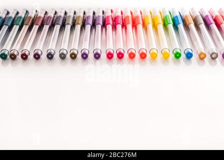 school supplies to paint with ordered colored markers for children on a white background Stock Photo