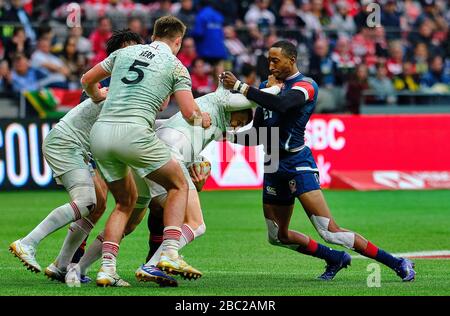 Vancouver, Canada. 8th March, 2020. Will Edwards #9 of England tackled by Perry Baker #11 (right) of USA in Match #43 USA vs England (5th Place Play-o Stock Photo