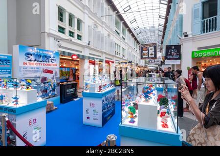 People taking pictures to an exhibition of The Smurfs, Bugis Junction, Singapore Stock Photo