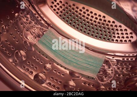 Wear surgical mask in washing machine Stock Photo